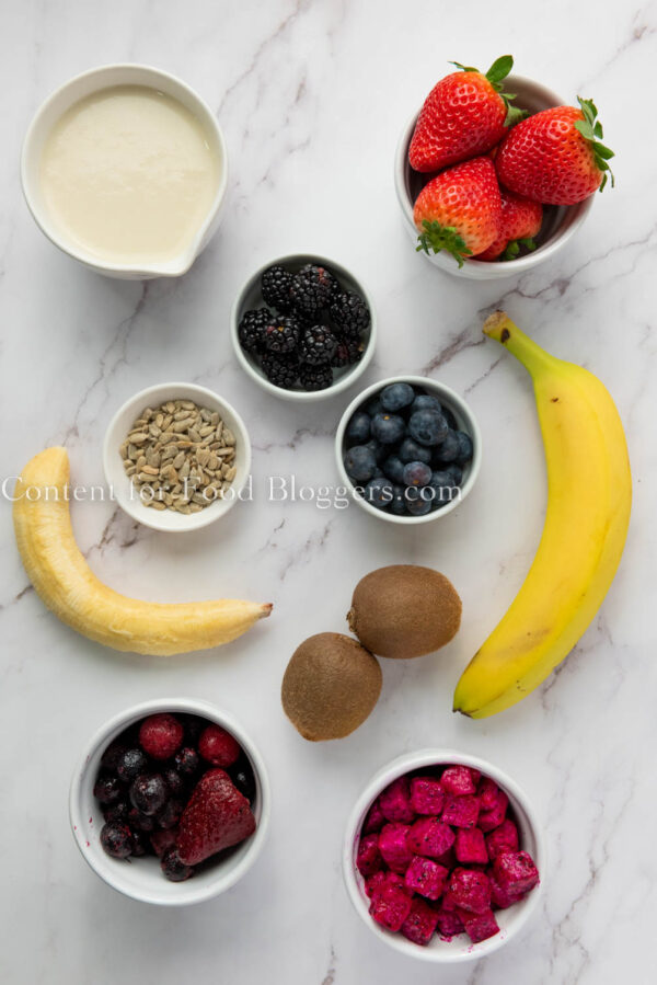 ingredient picture with strawberries, bananas and other red fruit